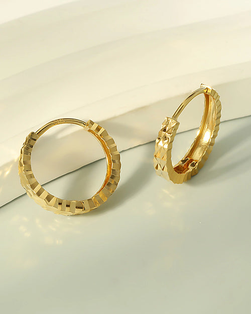 Faceted gold hoop earrings minimalist luxury design