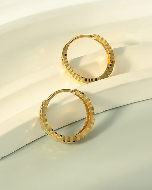 Faceted gold hoop earrings minimalist luxury design