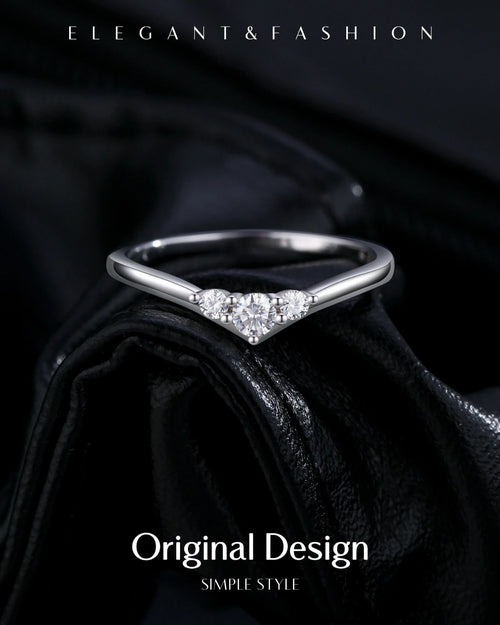 Elegant V-shaped moissanite ring on black background