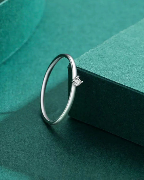 Minimalist silver moissanite ring close-up