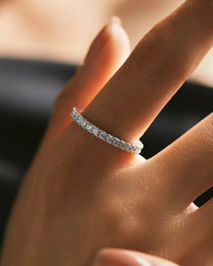 Moissanite eternity ring on hand natural light