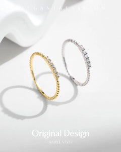 Moissanite stacking rings displayed in soft studio lighting