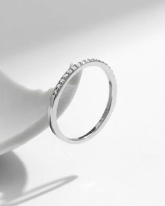 Side view of dainty moissanite pavé band