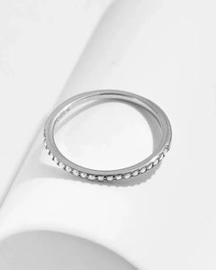 Top view of thin moissanite pavé ring