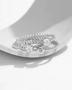 beaded moissanite rings stacked together