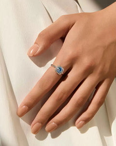 Blue Round Moissanite Halo Ring Worn on Hand