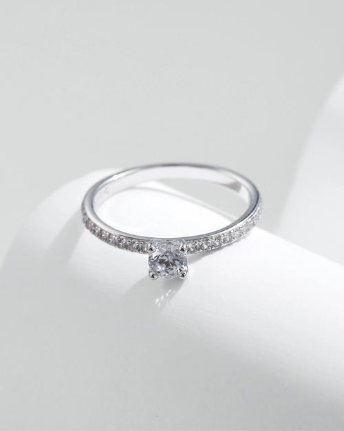 elegant pavé solitaire ring on display
