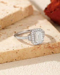 emerald cut halo moissanite engagement ring angled view