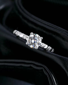 Front view of twisted solitaire moissanite engagement ring