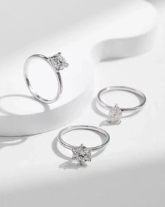 AriaEcho three solitaire moissanite rings artistic display