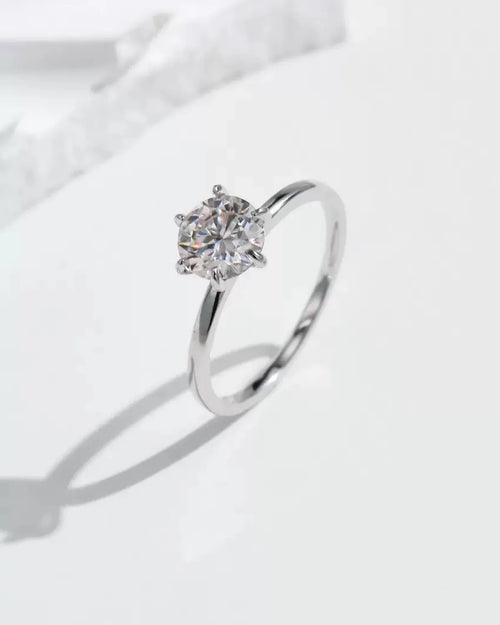 Single solitaire moissanite ring artistic shadow photography