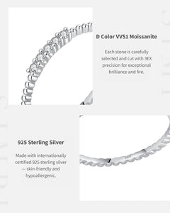 Close-up of D color VVS1 moissanite stones on twisted band