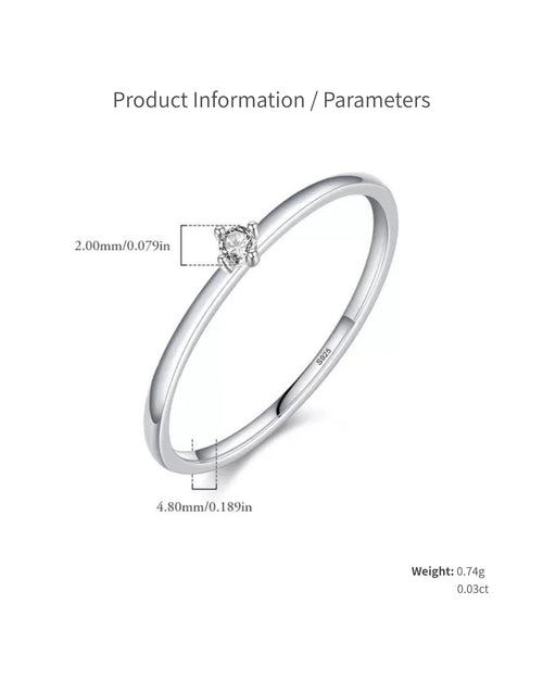 Close-up of dainty moissanite solitaire ring