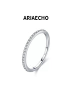 Dainty moissanite pavé ring in sterling silver