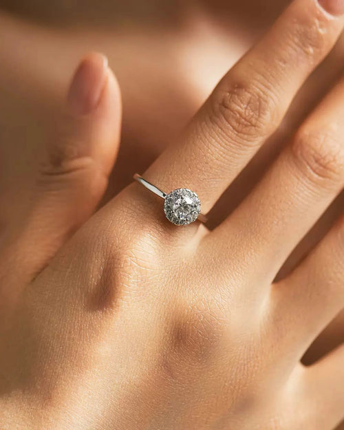 Halo moissanite ring worn on hand – delicate minimalist style