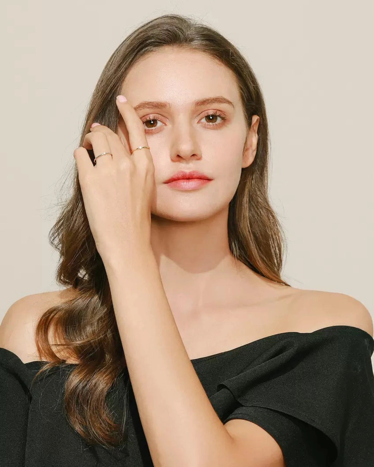 Model wearing dainty stacking rings