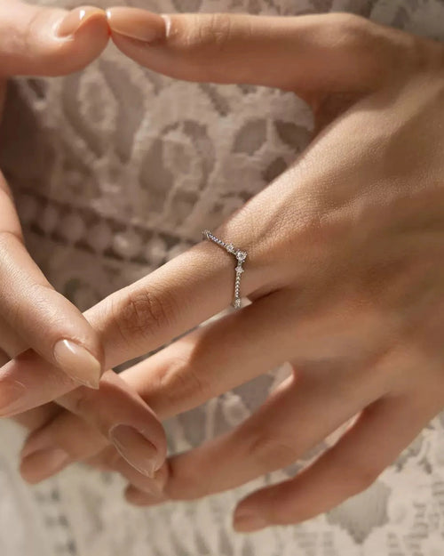 Moissanite crown ring on hand – lifestyle image