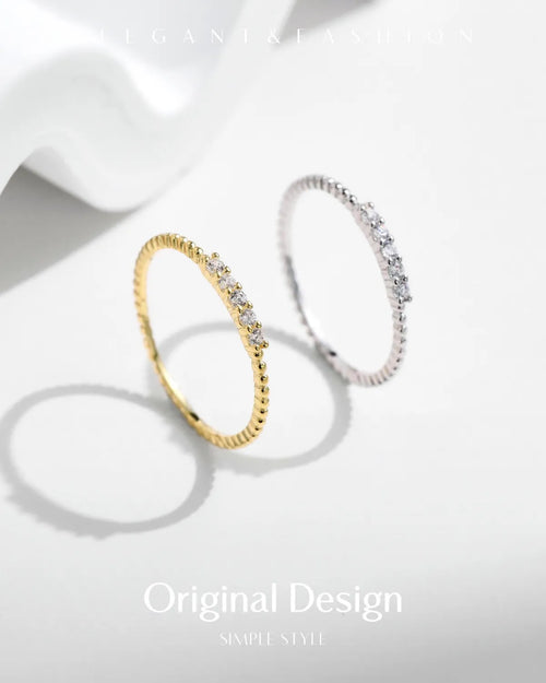 Moissanite stacking rings displayed in soft studio lighting