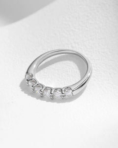 Six-Stone Moissanite Band Ring – close-up under soft light