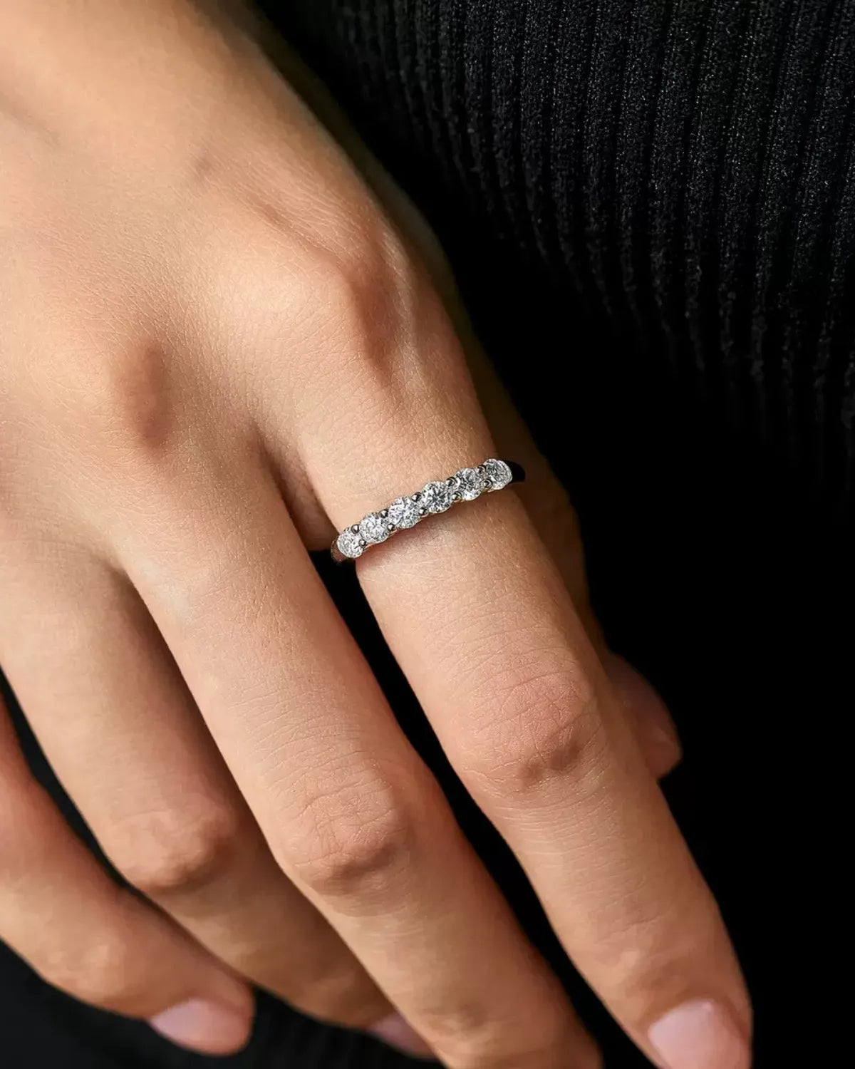 Six-Stone Moissanite Band Ring – worn on hand, natural light