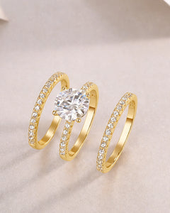 Side angle view of 18K gold plated moissanite wedding ring set with triple row pavé detailing