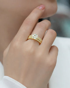 18K gold moissanite bridal ring set worn on hand showing triple band sparkle