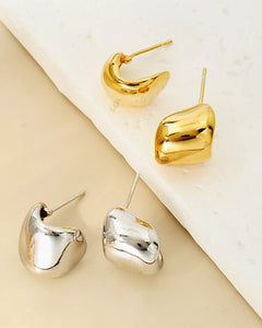 Sculptural chunky gold stud earrings luxury lifestyle styling