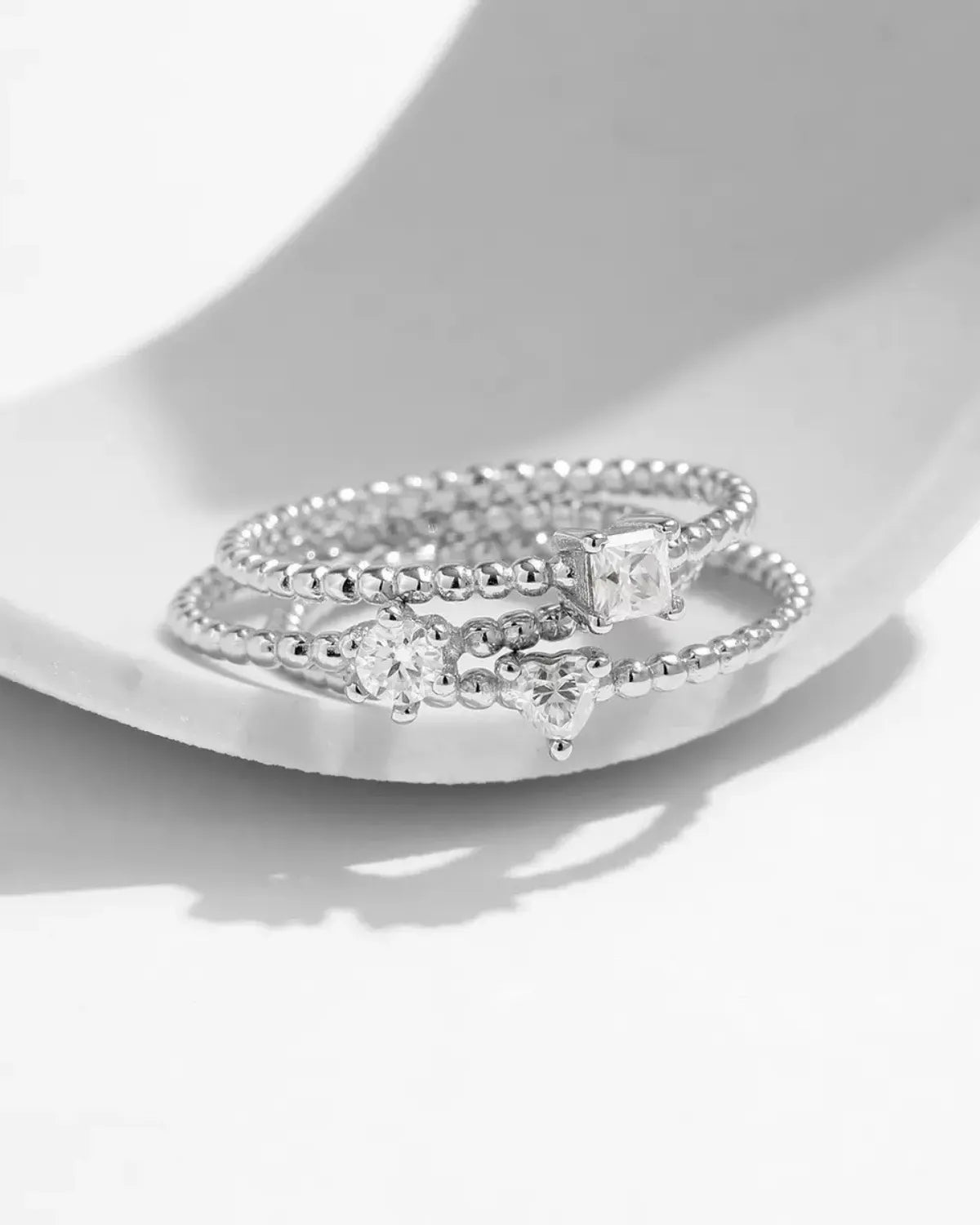 beaded moissanite rings stacked together