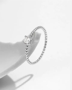 close-up beaded band moissanite ring