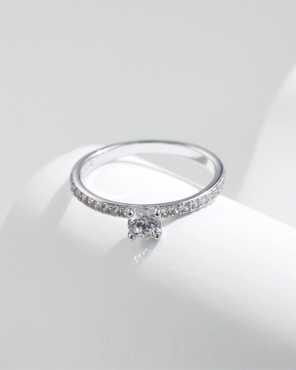 elegant pavé solitaire ring on display