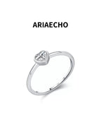 heart cut minimalist moissanite ring on white background