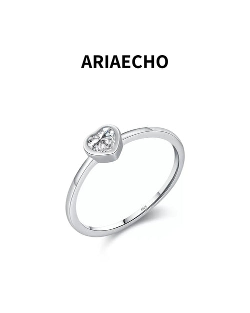 heart cut minimalist moissanite ring on white background