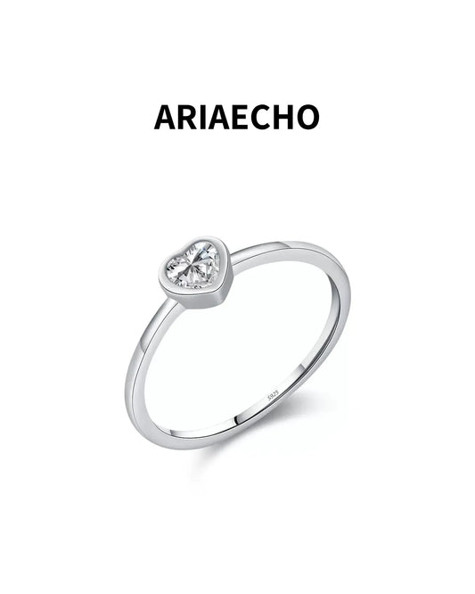 heart cut minimalist moissanite ring on white background
