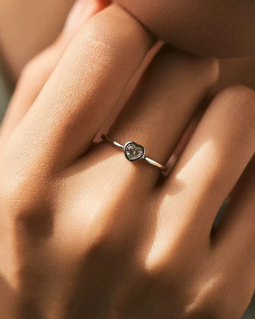 heart cut moissanite ring worn on hand (natural light)