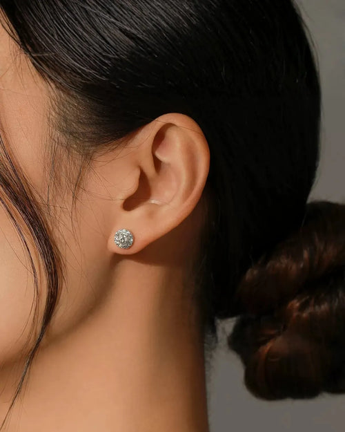 moissanite stud earrings worn on ear