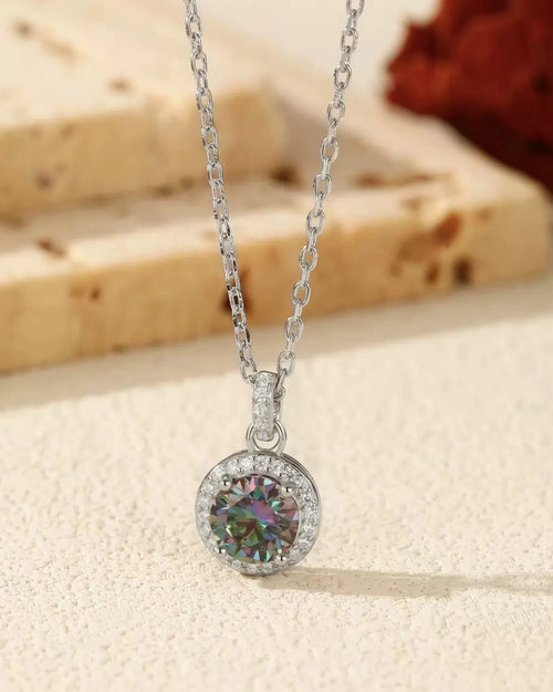 mystic-moissanite-halo-necklace-flat-lay.webp