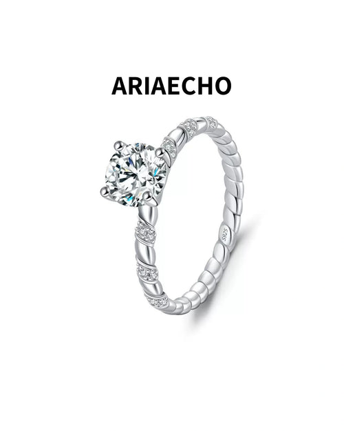 Twisted solitaire moissanite ring in 925 sterling silver